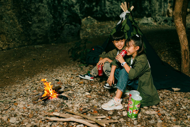 Kids sharing a cola